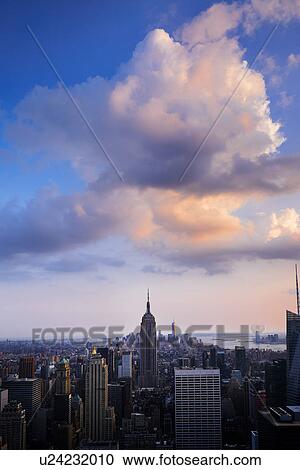 Stock Image - City skyline at dusk. Fotosearch