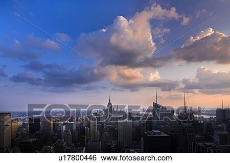 Stock Photograph - City skyline at dusk. Fotosearch