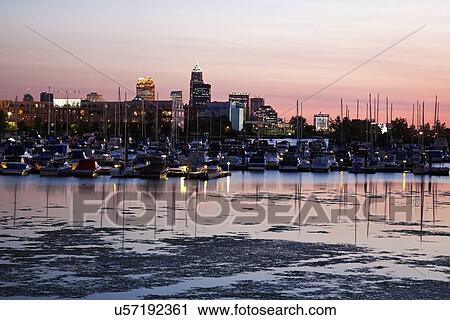 Stock Image - Cityscape and marina seen from lake Erie. Fotosearch