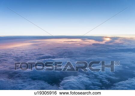 Stock Photograph - Clouds at sunrise. Fotosearch