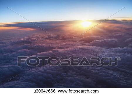 Clouds at sunrise View Large Photo Image Stock Photograph - Clouds at sunrise. Fotosearch
