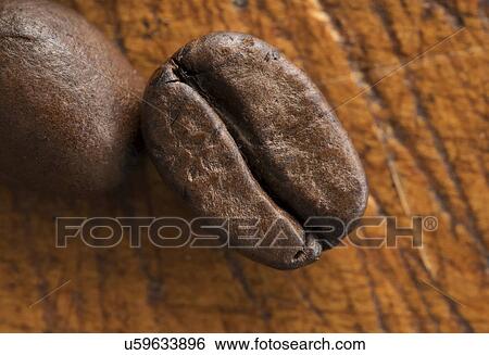 Coffee beans on table View Large Photo Image Stock Photograph - Coffee beans on table. Fotosearch