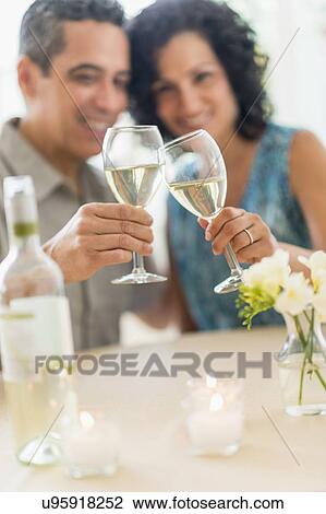 Couple celebrating anniversary in restaurant View Large Photo Image Stock Image - Couple celebrating anniversary in restaurant. Fotosearch