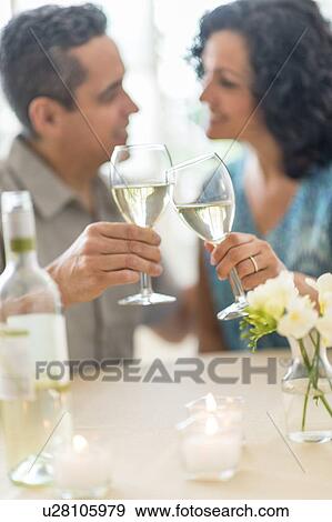 Stock Photo - Couple celebrating anniversary in restaurant. Fotosearch
