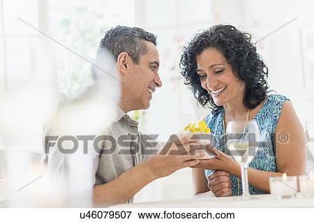 Couple celebrating anniversary in restaurant View Large Photo Image Stock Photo - Couple celebrating anniversary in restaurant. Fotosearch