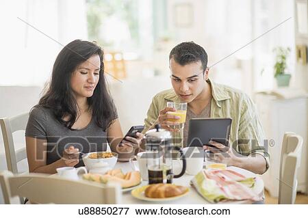 Couple in dining room View Large Photo Image Stock Photo - Couple in dining room. Fotosearch