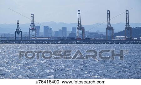 Cranes in harbor View Large Photo Image Stock Image - Cranes in harbor. Fotosearch