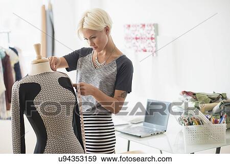 Designer creating dress View Large Photo Image Stock Photo - Designer creating dress. Fotosearch