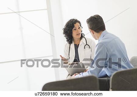 Doctor talking to patient View Large Photo Image Stock Image - Doctor talking to patient. Fotosearch