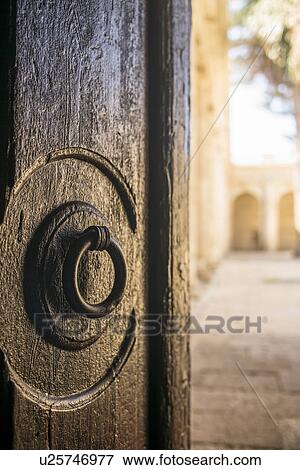 Stock Photo - Door knocker on Cathedral of Almeria. Fotosearch