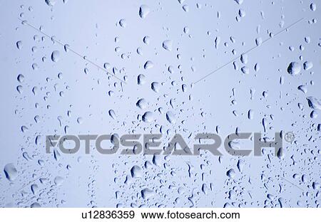 Stock Photo - Drops of water on glass. Fotosearch