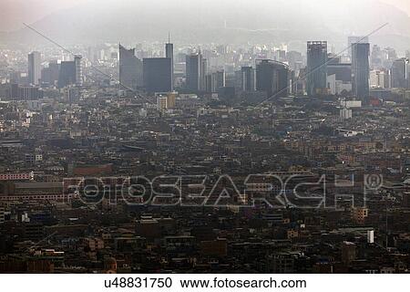 Stock Image - Elevated view of crowded city. Fotosearch