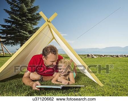 Father and daughter (2-3) playing in tent View Large Photo Image Stock Image - Father and daughter (2-3) playing in tent. Fotosearch