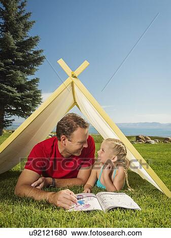 Father and daughter (2-3) playing in tent View Large Photo Image Stock Image - Father and daughter (2-3) playing in tent. Fotosearch