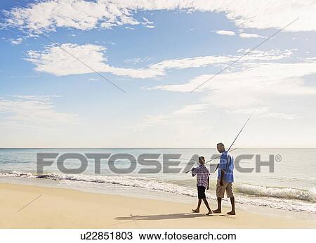 Father and son (10-11) fishing View Large Photo Image Stock Image - Father and son (10-11) fishing. Fotosearch