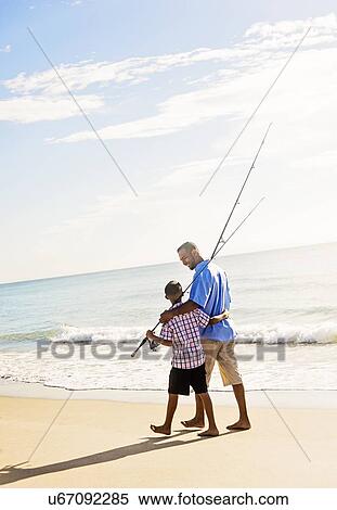 Father and son (10-11) fishing View Large Photo Image Stock Photography - Father and son (10-11) fishing. Fotosearch