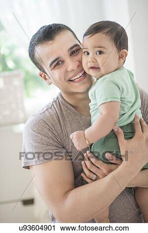 Father holding his son (6-11 months) View Large Photo Image Stock Image - Father holding his son (6-11 months). Fotosearch