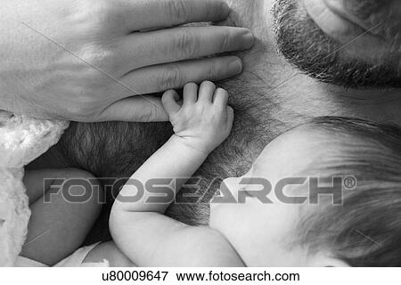 Father holding newborn daughter View Large Photo Image Stock Photo - Father holding newborn daughter. Fotosearch