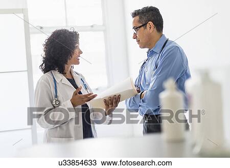 Female and male doctors working together View Large Photo Image Stock Image - Female and male doctors working together. Fotosearch