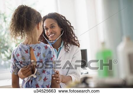 Female doctor examining girl (8-9) View Large Photo Image Stock Image - Female doctor examining girl (8-9). Fotosearch