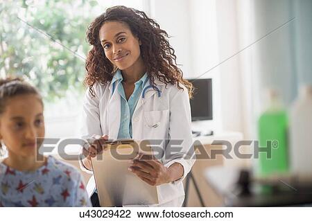 Female doctor examining girl (8-9) View Large Photo Image Stock Image - Female doctor examining girl (8-9). Fotosearch
