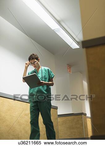 Female doctor in hospital corridor View Large Photo Image Stock Photography - Female doctor in hospital corridor. Fotosearch