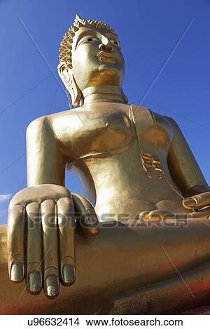 Picture - Golden sitting Buddha . Fotosearch