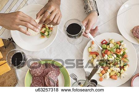 Hands serving salad View Large Photo Image Stock Photo - Hands serving salad. Fotosearch