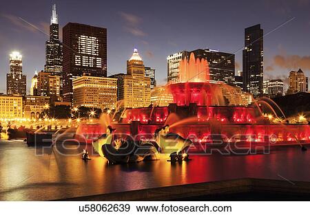 Illuminated Buckingham Fountain at dusk View Large Photo Image Stock Photo - Illuminated Buckingham Fountain at dusk. Fotosearch