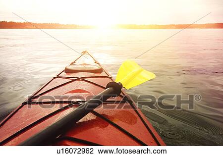 Stock Image - Kayaking on lake. Fotosearch