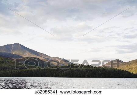 Stock Image - Lake Placid and mountains. Fotosearch
