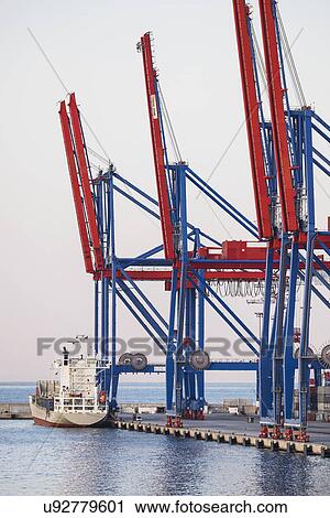 Stock Image - Malaga, Cargo container in harbor. Fotosearch