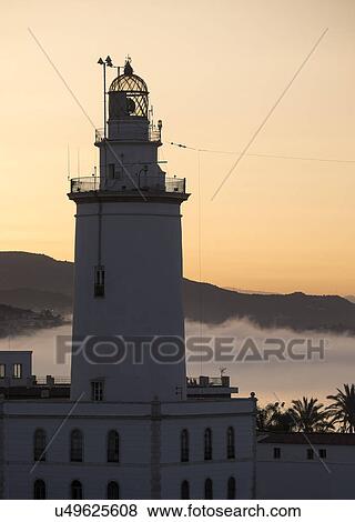 Malaga, Lighthouse at sunset View Large Photo Image Stock Photo - Malaga, Lighthouse at sunset. Fotosearch