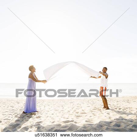 Man and woman on beach View Large Photo Image Stock Image - Man and woman on beach. Fotosearch