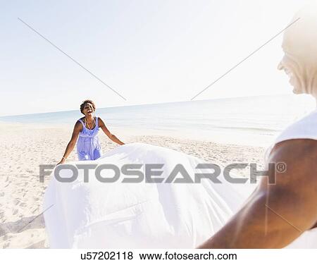 Man and woman on beach View Large Photo Image Stock Photo - Man and woman on beach. Fotosearch