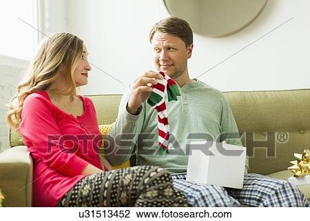 Man holding unwanted Christmas gift View Large Photo Image Stock Image - Man holding unwanted Christmas gift. Fotosearch