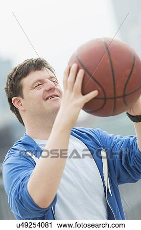 Man with down syndrome playing basketball View Large Photo Image Stock Image - Man with down syndrome playing basketball. Fotosearch