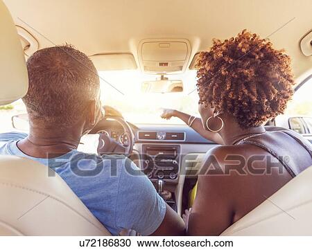 Stock Image - Mature couple in car. Fotosearch