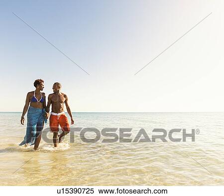 Mature couple walking in sea View Large Photo Image Stock Photography - Mature couple walking in sea. Fotosearch