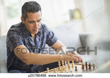 Mature man playing chess View Large Photo Image Stock Photo - Mature man playing chess. Fotosearch