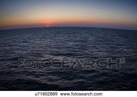 Stock Photo - Mediterranean sea at sunset. Fotosearch