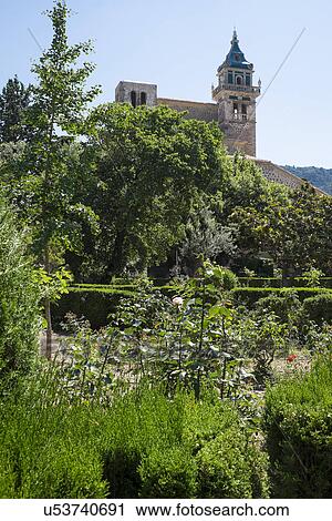Stock Image - Monastery in garden. Fotosearch