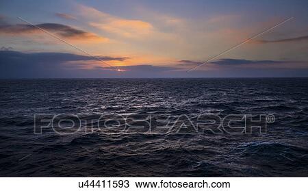 Stock Image - Ocean at sunset. Fotosearch