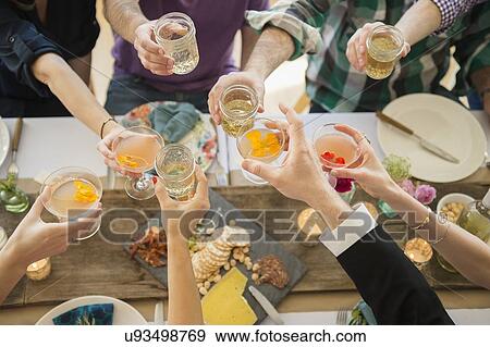 People toasting at party View Large Photo Image Stock Photo - People toasting at party. Fotosearch