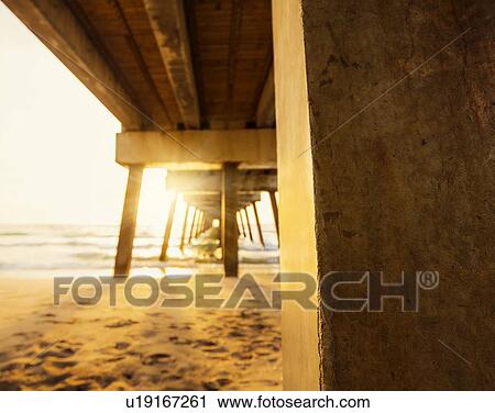 Stock Image - Pier in sunlight. Fotosearch