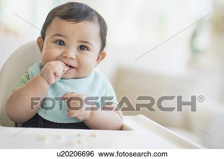 Stock Photograph - Portrait of baby boy (6-11 months). Fotosearch