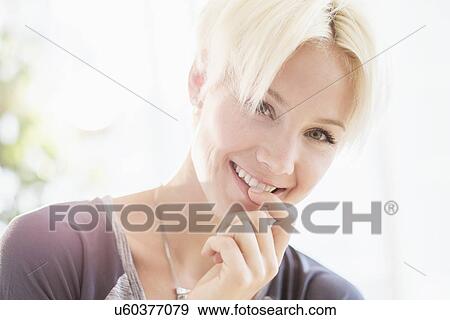 Portrait of blonde woman smiling View Large Photo Image Stock Photo - Portrait of blonde woman smiling. Fotosearch