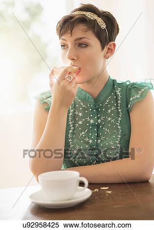Portrait of brunette eating bread View Large Photo Image Stock Photography - Portrait of brunette eating bread. Fotosearch