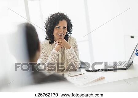 Portrait of businesswoman in office View Large Photo Image Stock Image - Portrait of businesswoman in office. Fotosearch
