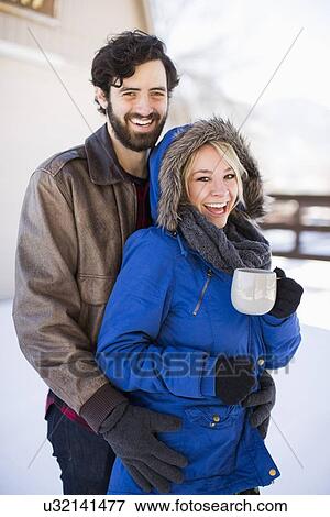 Portrait of happy couple in winter View Large Photo Image Stock Photo - Portrait of happy couple in winter. Fotosearch